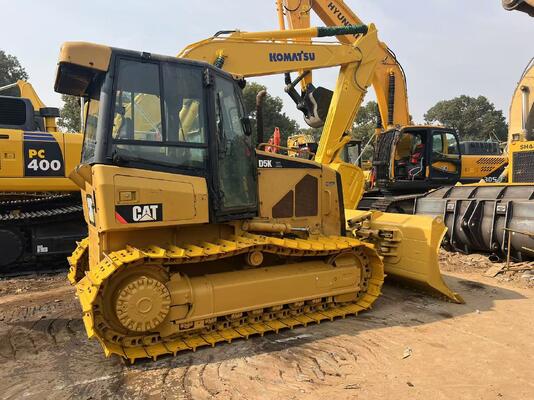 جرافة ذات شفرة بستة اتجاهات مثبتة على زحافات CAT D5K XL لون أصلي